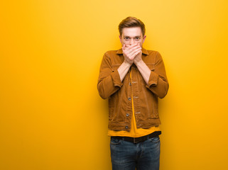Fototapeta premium Young redhead man surprised and shocked