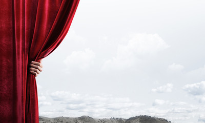 Summer natural bluesky view behind red velvet curtain