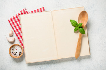 Cooking concept with cookbook on kitchen table - 267644090