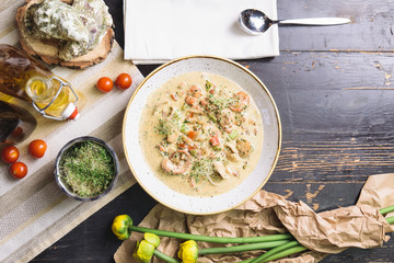 creamy seafood soup on wooden table