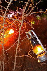 Lantern outside in tree with flame