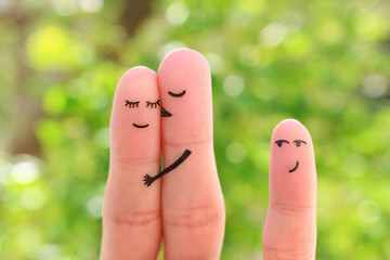 Fingers art of happy family. Concept of couple kisses, child glances after them.