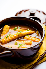Baby Corn Manchurian with gravy - popular Indo-chinese recipe. selective focus