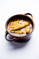 Baby Corn Manchurian with gravy - popular Indo-chinese recipe. selective focus