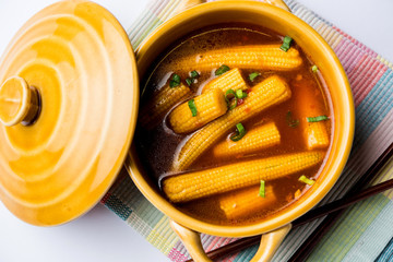 Baby Corn Manchurian with gravy - popular Indo-chinese recipe. selective focus