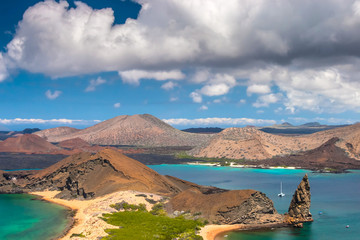 Galapagos. Ecuador. Panorama of the Galapagos islands from Bartolome island. Santiago island...