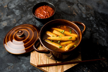 Baby Corn Manchurian with gravy - popular Indo-chinese recipe. selective focus