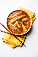 Baby Corn Manchurian with gravy - popular Indo-chinese recipe. selective focus
