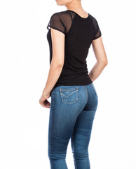 Obraz premium Female fashion, young woman with black blouse and jean - photo on white background