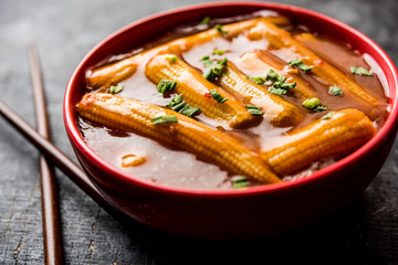 Baby Corn Manchurian with gravy - popular Indo-chinese recipe. selective focus
