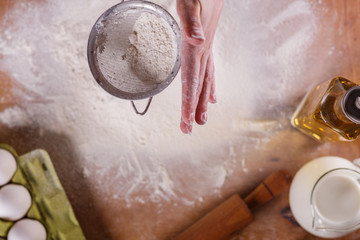 young woman squirting a flour in an apron