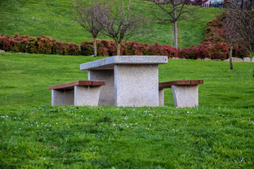 stone table and benches in a park