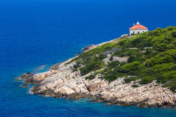 Fototapeta na wymiar Lighthouse Host on Host small island close to Vis island and Vis town