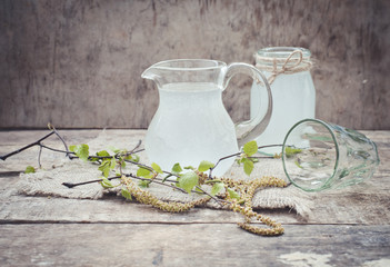glass of birch juice on wooden table
