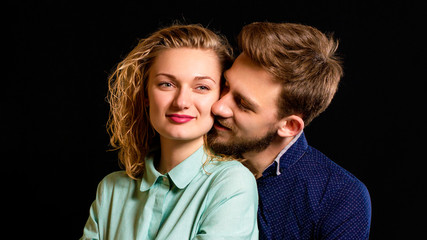 young sexy couple portrait photo on black background