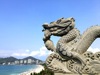 stone dragon China sandy beach Sanya hotels