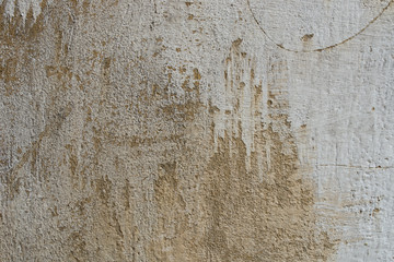 old obsolete beige plastered wall background texture