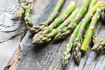 fresh green asparagus on wooden table