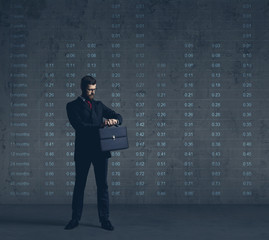 Businessman in formalwear over dark background. Business, finance, career and office concept.