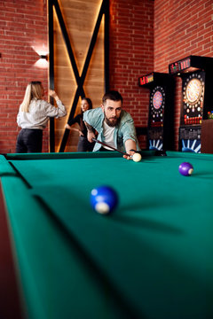 Man playing billiards