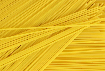 Spaghetti - yellow pasta, ready for cooking. isolated on the white background. uncooked spaghetti noodles. Uncooked whole wheat pasta. 