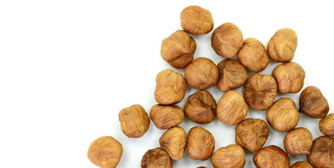 Heap of hazelnuts isolated on white background