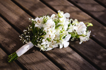 wedding bouquet on wooden table, rustic bouquet for bride.