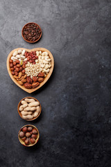 Various nuts selection on stone table