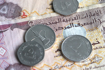 close-up of Dirham money from the United Arab Emirates, notes and coins, with short depth of field