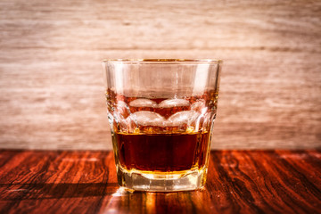 Brandy or liquor,Set of strong alcoholic drinks in glasses and shot glass on dark wood background