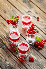 Red currant liquor with sugar and mint