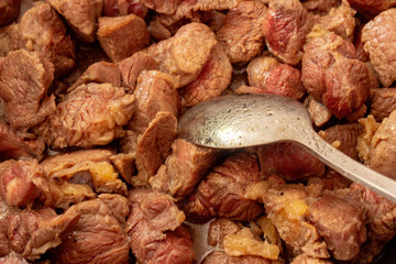 Roast meat in a black frying pan