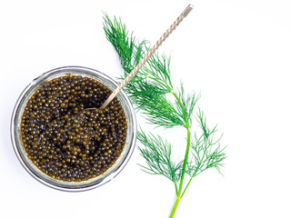 Vintage silver spoon with black sturgeon caviar on white background. Top view, flat lay