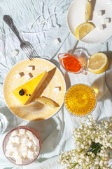 Mango pie slice on a table with lemon and sugar