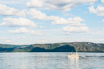 trip to nordkapp, view to a fjord with a boat