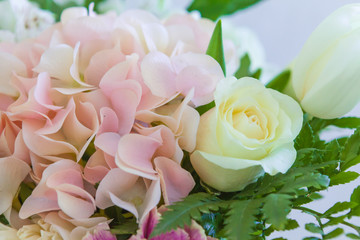 Wedding flowers, bridal bouquet closeup. Decoration made of roses and decorative plants, close-up