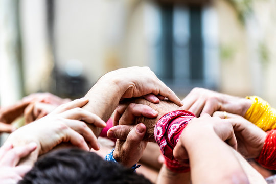 Close-up of the joining hands building a "castell"