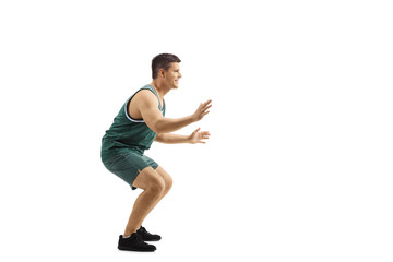 Man playing defence in basketball