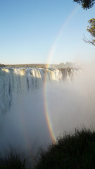 Victoria Falls Waterfall with Rainbow near Livingstone, Zambia.