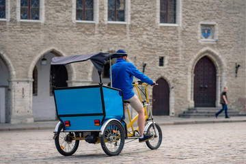 Tricycle taxi for tourists on city center street