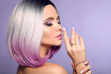 Beautiful lady presents amethyst ring and bracelet jewelry set. Woman portrait with ombre bob short...