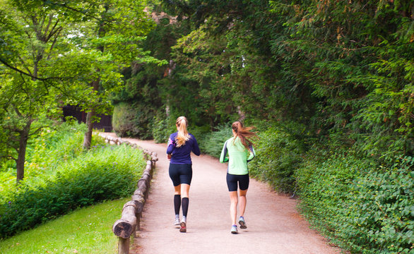 Two girls running in the park in Copenhagen
