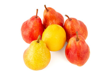 Dessert of ripe fragrant appetizing pink pears and yellow lemon on a white background
