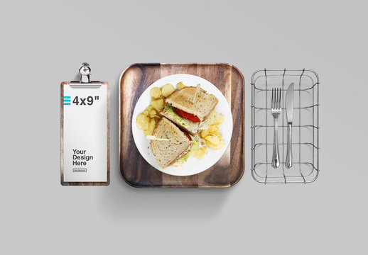 Top View Mockup of Dinner Plate, Clipboard, Wood Tray, and Utensils in Metal Basket