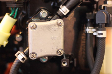 Fuel system, low pressure gasoline pump of boat outboard motor close up