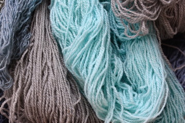 Color yarn for knitting, knitting wool balls . Beautiful yarn knitting background. Close up of multi colored kitting yarn.