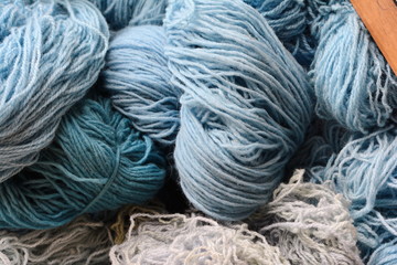 Color yarn for knitting, knitting wool balls . Beautiful yarn knitting background. Close up of multi colored kitting yarn.