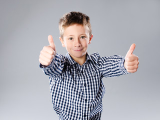 Little boy with thump up gesture