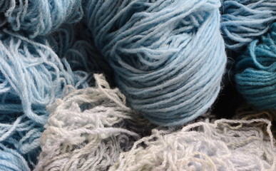 Color yarn for knitting, knitting wool balls . Beautiful yarn knitting background. Close up of multi colored kitting yarn.