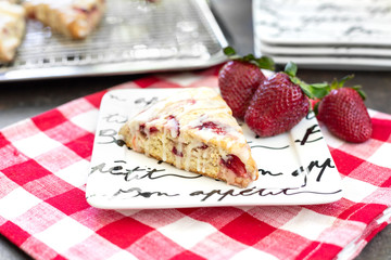 Freshly Baked Strawberry Scone on Bon Appetit Plate with Fresh Strawberries and Red and White Checked Napkin